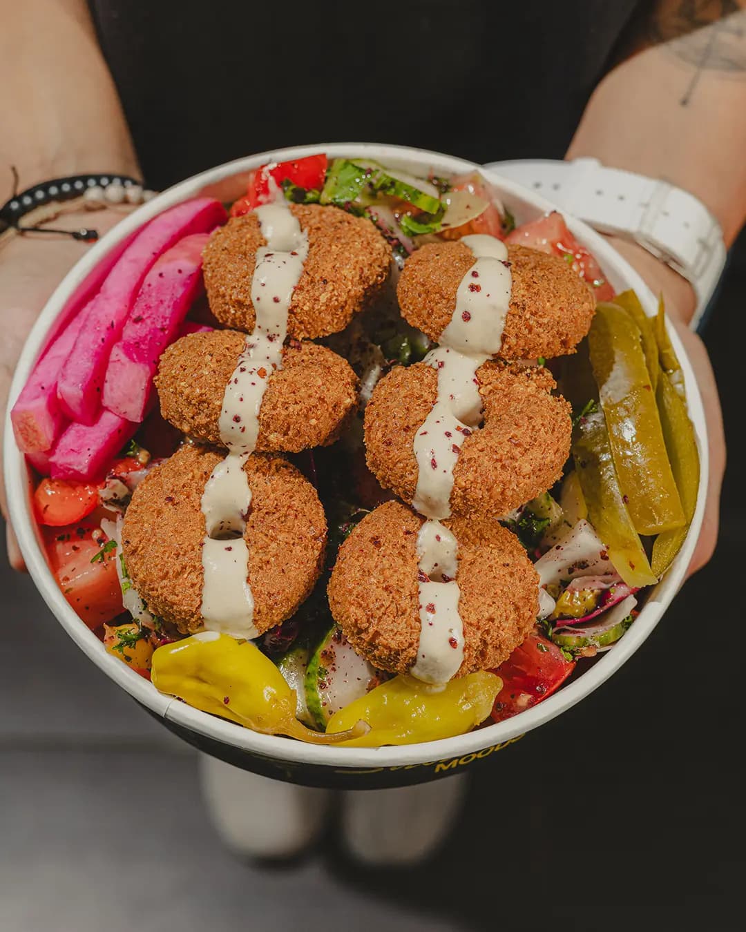 Falafel bowl with pickles and tahini