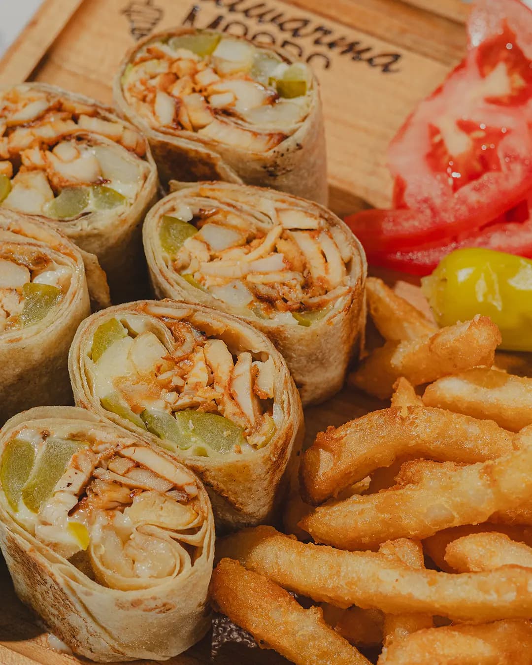 Saj wraps sliced and arranged on a wooden board